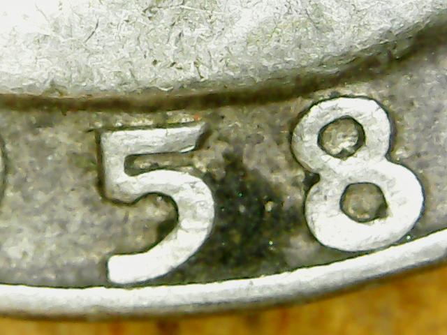 Does-The-Die-Chip-On-This-1958-D-Quarter-Give-It-Any-More-Value?